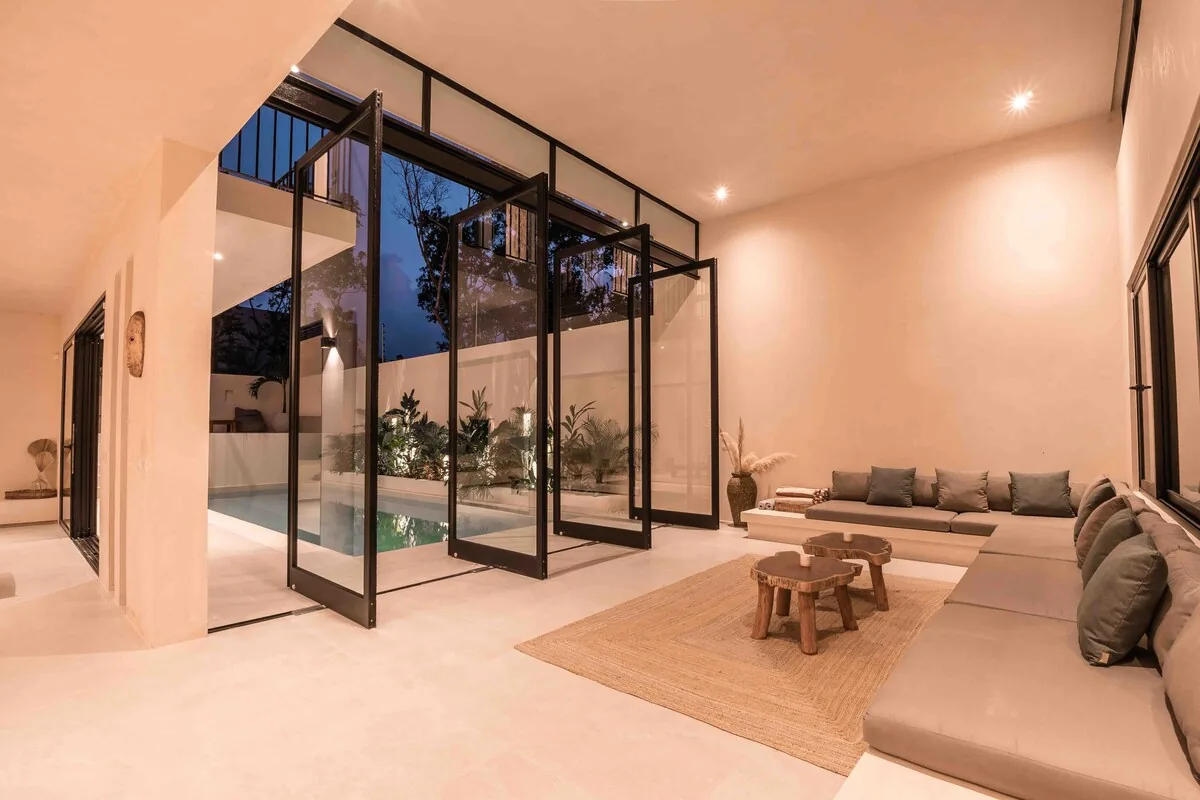 Casa H minimalist living room with large windows and pool view